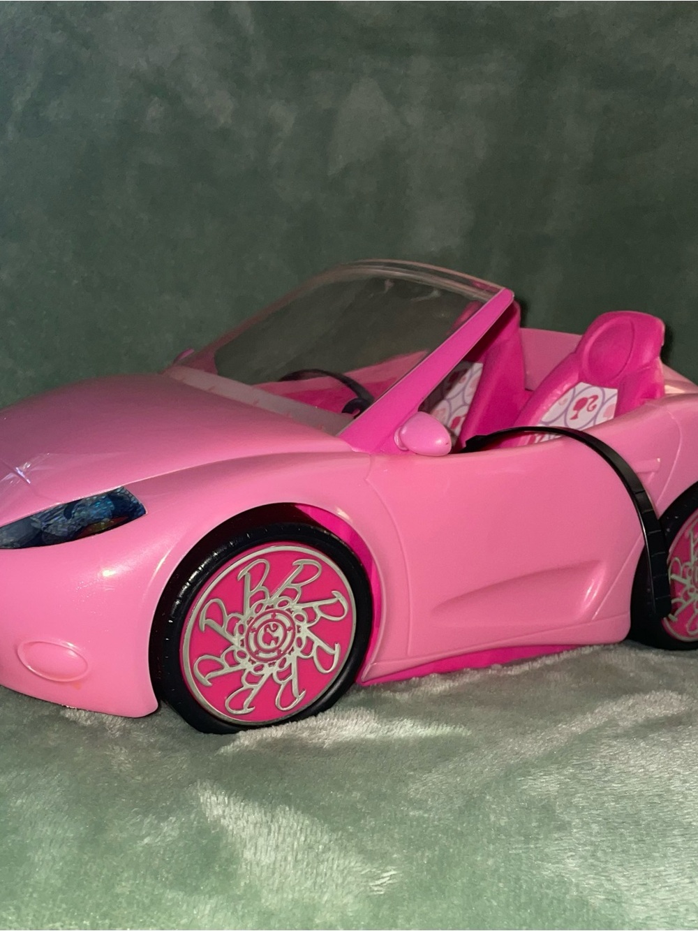 Barbie Pink Convertible Toy Car by Mattel with Decorative “B” Wheels